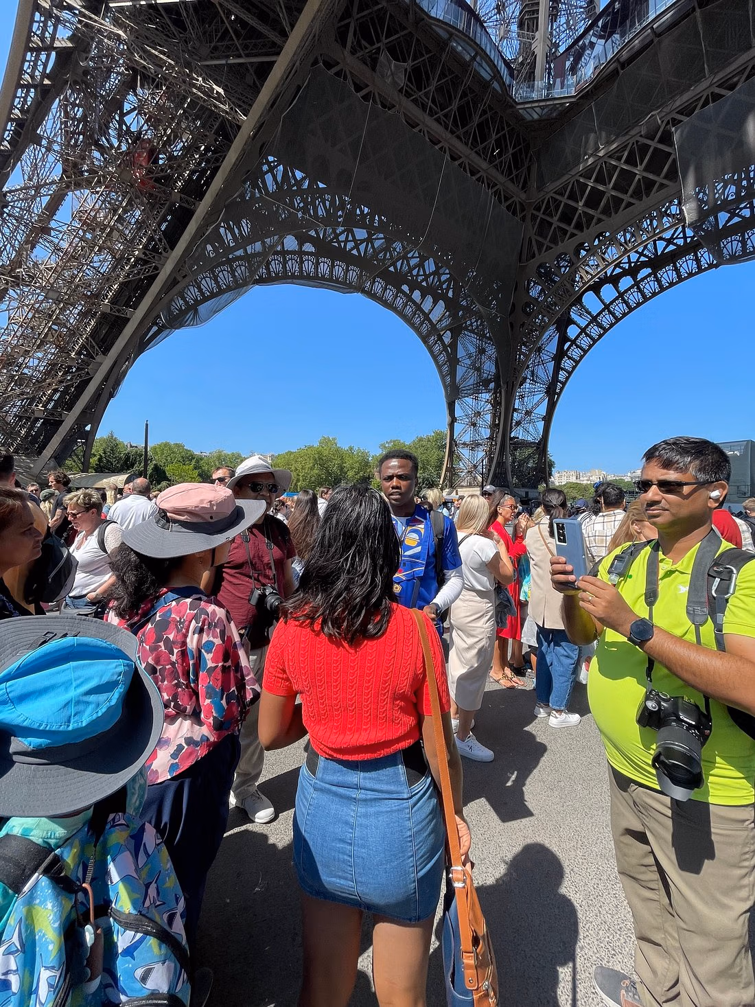 Bayo touring Eiffel Tower with group