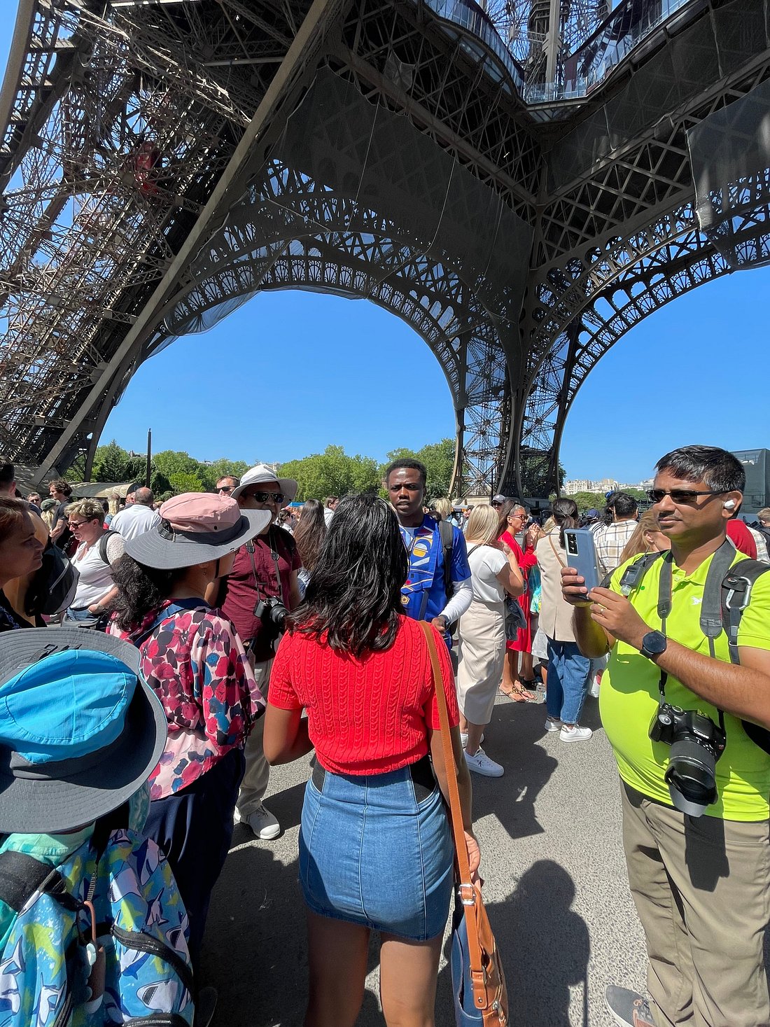 Bayo touring Eiffel Tower with group